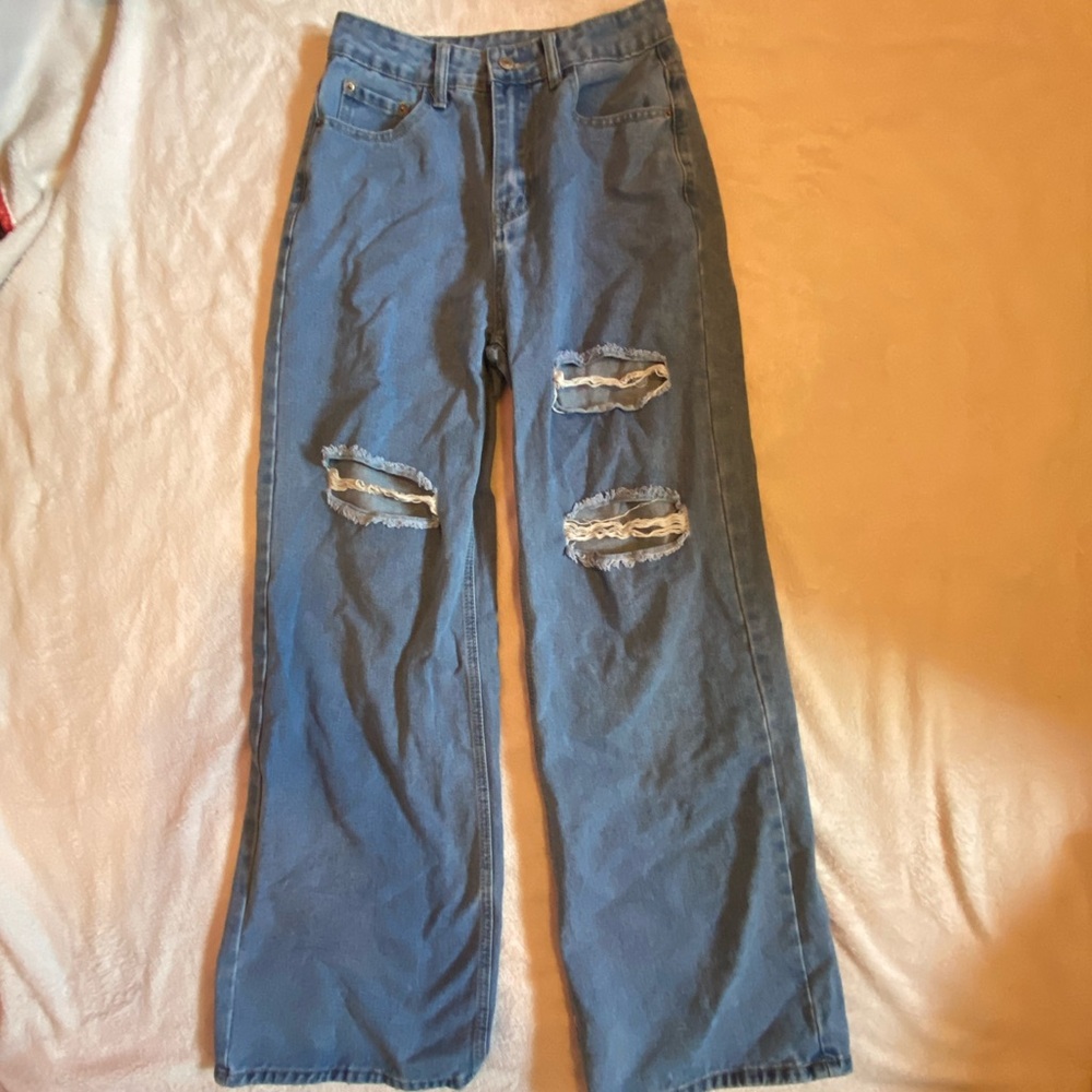 Ripped baggy blue jeans